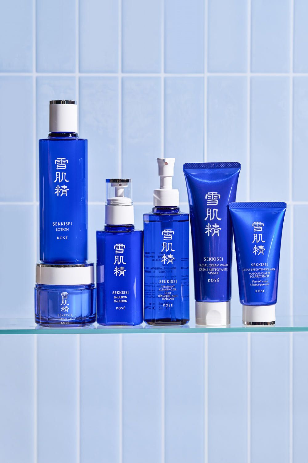 Set of SEKKISEI products on a shelf with a blue tiled background