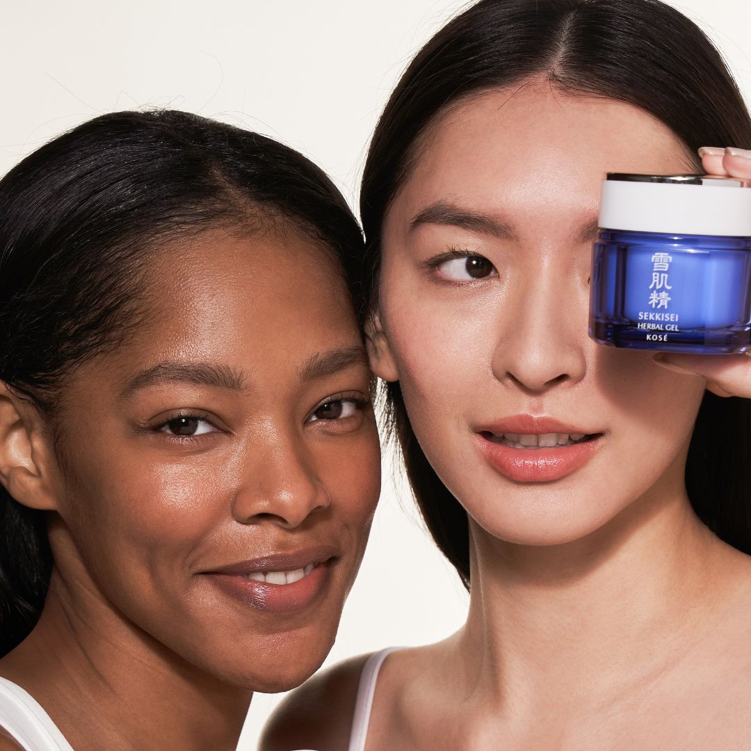Two women holding SEKKISEI Herbal Gel on a white background